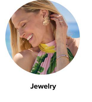 An image of a woman wearing statement earrings. Jewelry.