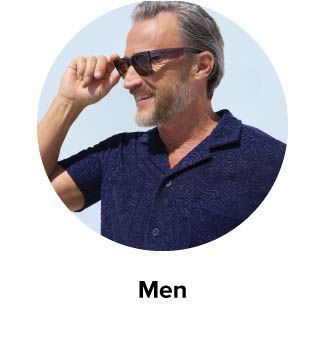 An image of a man in a polo and sunglasses. Men.