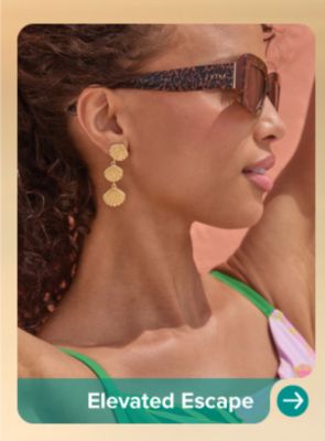 A woman in sunglasses and earrings. Elevated Escape.