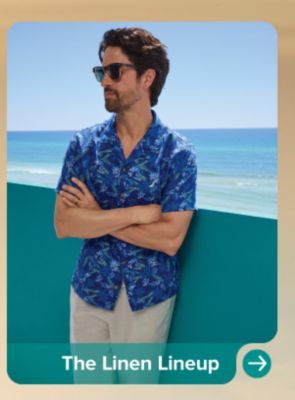 A man in a blue linen shirt and khakis. The Linen Lineup.