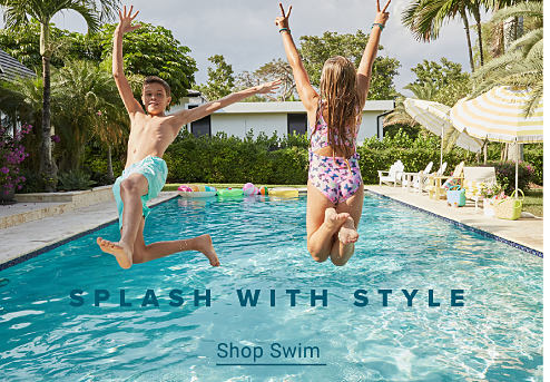 Two kids jumping into a pool. Splash with style. Shop swim.