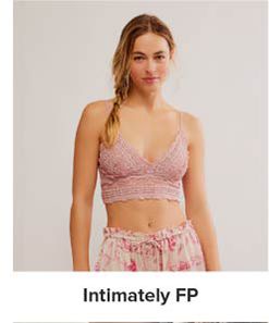 An image of a woman wearing a bralette and pajama bottoms. Shop Intimately FP.