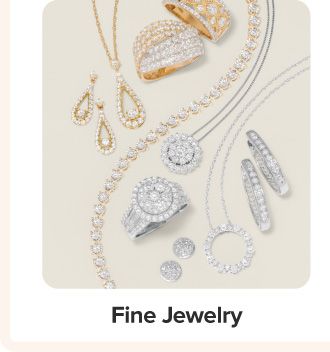An assortment of earrings, rings and necklaces. Shop fine jewelry.