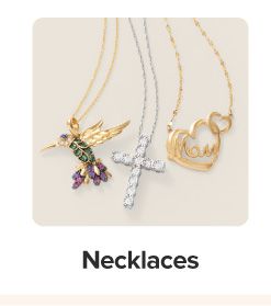 Necklaces featuring a hummingbird, heart and cross. Shop necklaces.