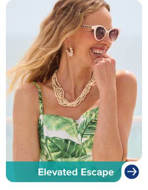 Image of a woman wearing sunglasses and gold tone drop earrings. Elevated escape.