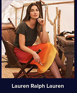 A woman wears a brown shirt and a long skirt with a gradient pattern going from orange to yellow. Lauren Ralph Lauren. 
