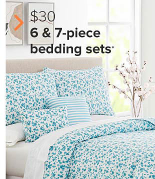 A blue floral bedding set. $30 six and seven piece bedding sets. 