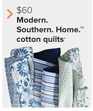 Quilts in blue floral and blue striped patterns. $60 Modern Southern Home cotton quilts.