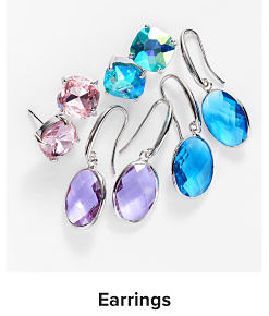 An image of four pairs of earrings in different colors and styles. Shop earrings.