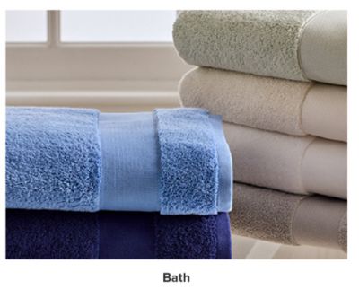 Stacks of folded towels in different colors. Bath.