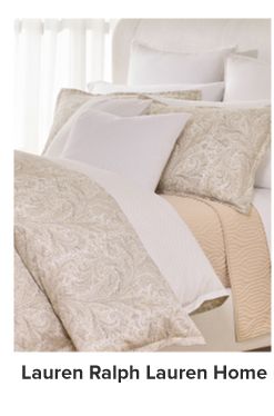 A bedding set in tans and whites. Lauren Ralph Lauren home.
