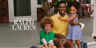 A father and his son and daughter sit on a porch together, all in Ralph Lauren clothing. The World of Ralph Lauren.