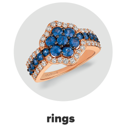 A ring with blue and white diamonds. Shop rings.
