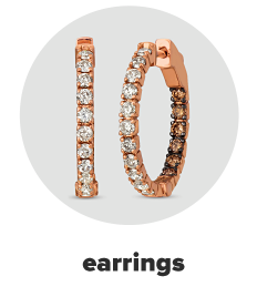 A pair of rose gold hoop earrings with white and chocolate diamond accents. Shop earrings.