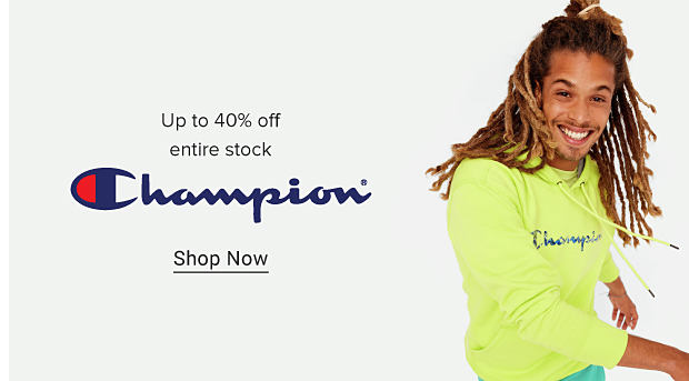 Man wearing a bright yellow Champion hoodie and green shorts. Up to 40% off entire stock. Champion. Shop Now. 