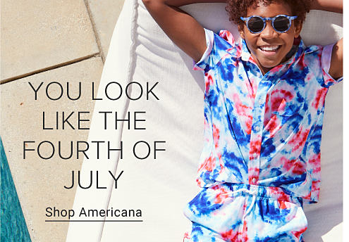 Boy wearing a red, white and blue button up shirt. You look like the fourth of July. Shop Americana. 