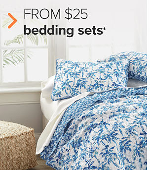A bedding set with blue palm trees on it. From $25 bedding sets. 