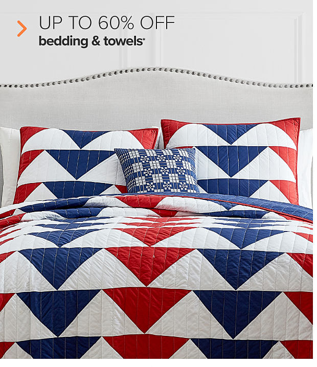 A bedding set with a red, white and blue striped pattern. Up to 60% off bedding and towels. 