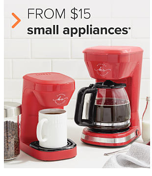 Two red coffee makers. One is the more traditional pot coffee maker, and the other uses pods. From $15 small appliances. 