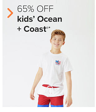 A boy in a white tee with an American flag on it, and red, white and blue swim trunks. 60% off kid's Ocean and Coast. 