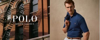 Man in navy blue polo shirt with jacket over shoulder. Polo Ralph Lauren. 