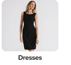 Image of a woman wearing a sleeveless dress. Dresses.