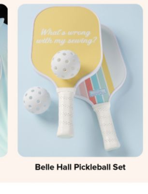 An image of pickleball paddles and balls. Belle Hall Pickleball set.