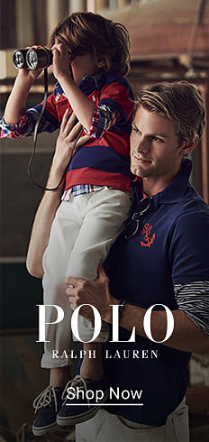 Image of a man wearing a blue polo shirt and a young boy wearing a striped rugby polo with white pants. Polo Ralph Lauren. Shop now.