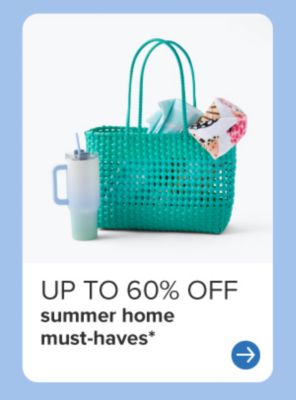 A teal beach bag with towels in it beside a big water cup. Up to 60% off summer home must haves.