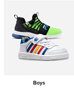 A green and black sneaker, a white sneaker with blue, red, and yellow stripes. Shop boys.
