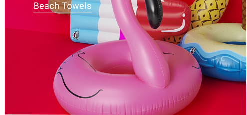Assorted pool floats, including a flamingo, pineapple, palm tree and popsicle. Splash zone. Pool days are the best days. Beach towels.