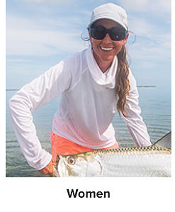 Woman wearing a cowl neck long sleeve and white hat and holding a fish. Women.