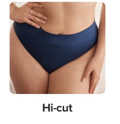 An image of a woman in a dark blue high cut panty. Shop high cut.