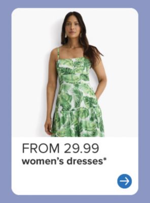 A woman wearing a green floral dress. From 29.99 women's dresses.