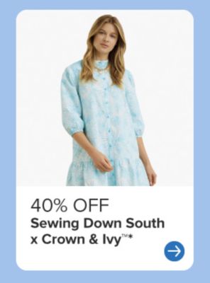 A woman wearing a blue floral dress. 40% off Sewing Down South x Crown & Ivy.