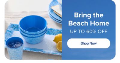 Blue dinnerware and sliced lemons on a table. Bring the beach home. Up to 60% off. Shop now.