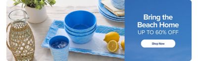 Blue dinnerware and sliced lemons on a table. Bring the beach home. Up to 60% off. Shop now.