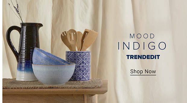 Blue and white pottery on wood table. Mood Indigo. TrendEdit. Shop Now.