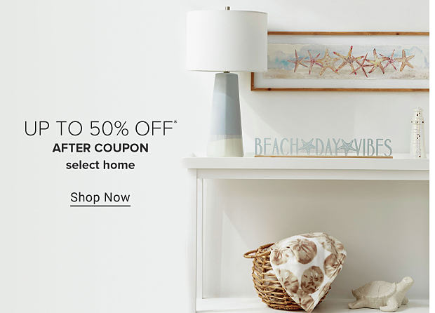 Coastal decor, including a blue lamp, a print of starfish and a wooden sign that says Beach Day Vibes. Up to 50% off after coupon select home. Shop now. 