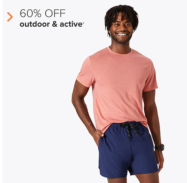 A man in a coral tee and dark blue shorts. 60% off outdoor and active. 