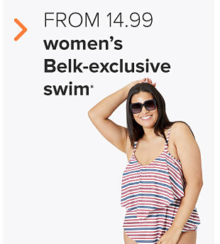 A woman in a red, white and blue striped swimsuit. From 16.99 women's Belk-exclusive swim.