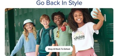 Four children taking a selfie in front of green lockers. Go back in style. Shop all back to school.