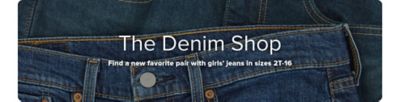 A close up image of jeans. The Denim Shop. Find a new favorite pair with girls' jeans in sizes 2T to 16.