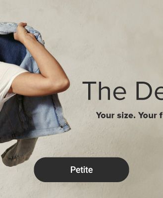 An image of a woman wearing a denim dress and holding a denim jacket. The Denim Shop. Your size. Your fit. Your new favorite pair. Shop petite.