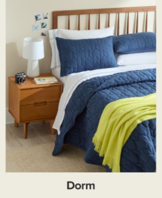 A blue bedding set. Shop dorm.
