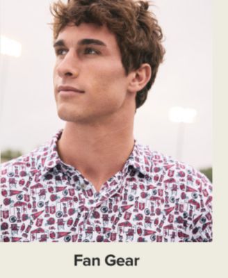 A man in a college button up. Shop fan gear.