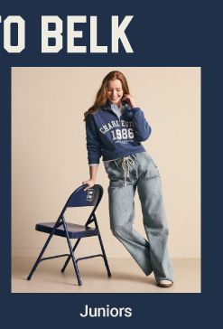 A teen girl leaning against a chair. Juniors. 