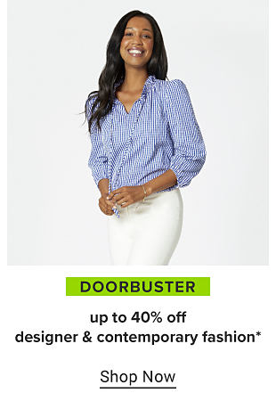 A woman in a blue and white striped top and white pants. Doorbuster, up to 40% off designer and contemporary fashion. Shop now.