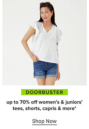 A woman in a white top and denim shorts. Doorbuster, up to 70% off women's and juniors' tees, shorts, capris and more. Shop now. 