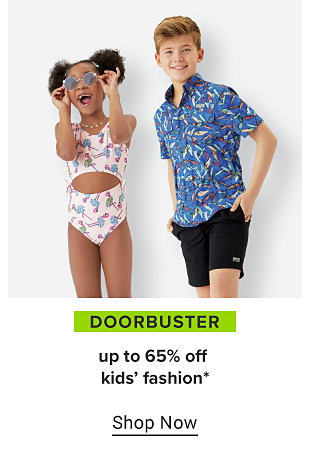 A girl in a pink two piece swimsuit with blue flowers, and a boy with a blue short sleeve shirt and black shorts. Doorbuster, up to 65% off kids' fashion. Shop now.